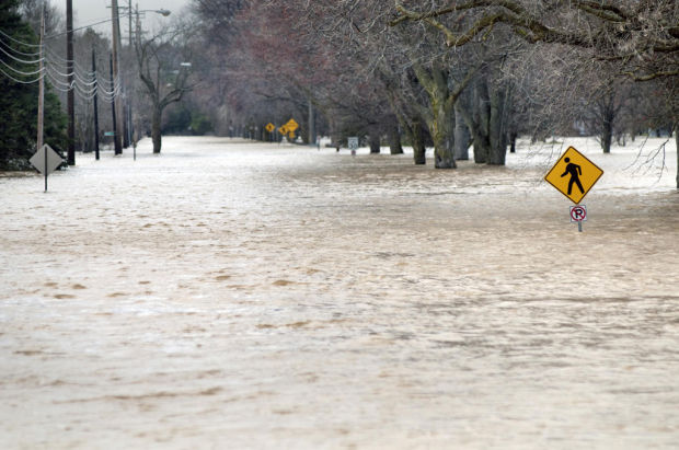 Floodwaters rising after heartland rains, and other national news